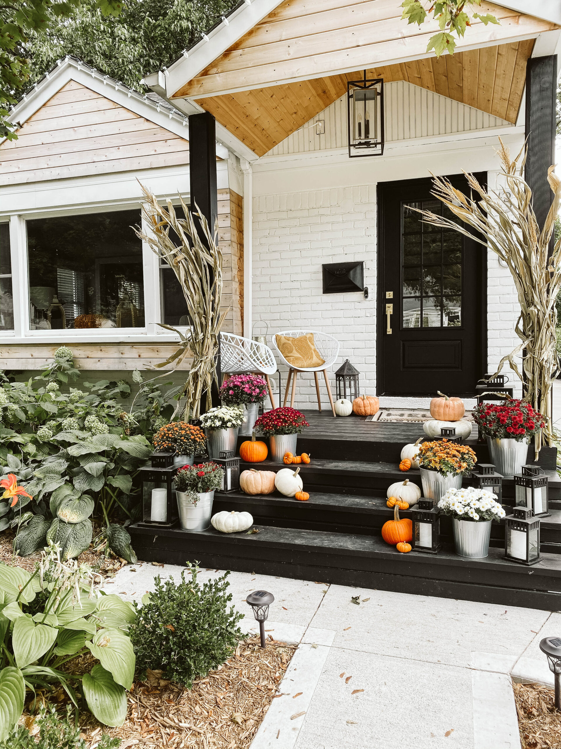 Fall decor ideas—Faux pumpkins on fall front porch 
